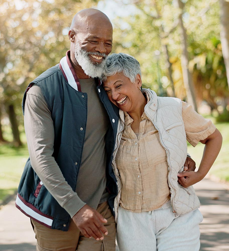 Smiling older couple walking outdoors